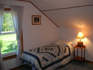 Front upstairs bedroom with twin beds