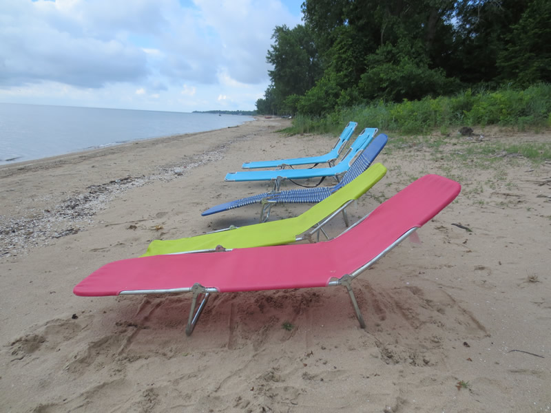 Lounge on the sandy beach directly in front of The Mermaid of Lorain cottage